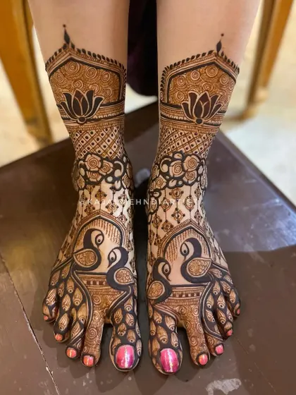 A classic bridal foot design with bold peacocks and intricate check patterns, complemented by lotus bands on the ankles.