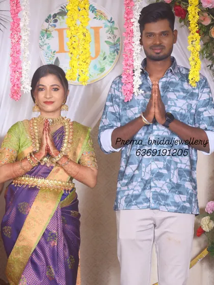 The couple greeting their guests. For this event, the bride changed into a purple saree, showing another beautiful way to style my rental temple jewellery.