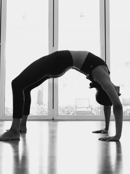 A classic Urdhva Dhanurasana (Wheel Pose) in the studio. This backbend is energizing and helps to open the entire front of the body.
