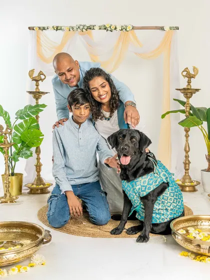 A family portrait from our Diwali mini-session. The black Labrador looks so handsome in his festive attire, posing with his loving family.