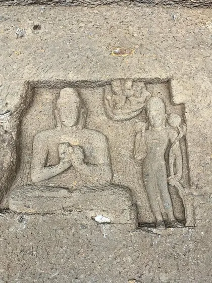 A close-up of a bas-relief carving at Kanheri Caves, showing the detailed storytelling in stone.