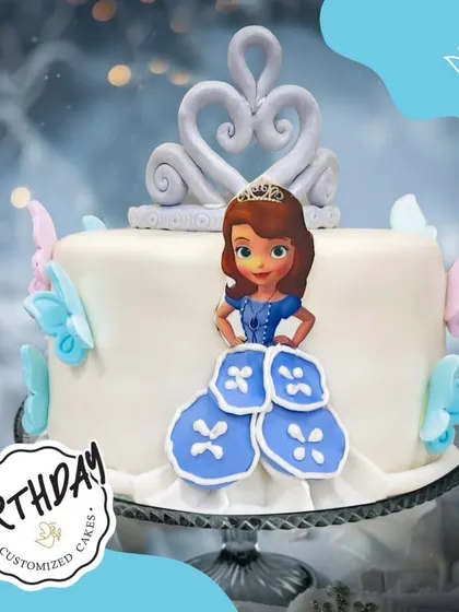 A charming Princess Sofia cake with a fondant crown and butterfly accents. The design is simple, elegant, and perfect for a little one who dreams of being a princess.