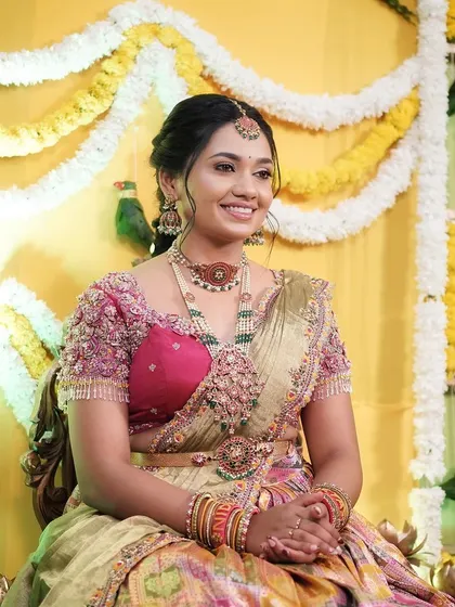 A happy moment from the Bhale Shastra, with the client looking radiant and surrounded by festive decorations.