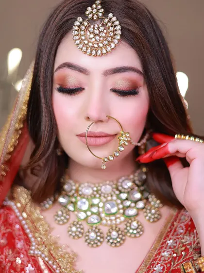 A detailed close-up of the bride's makeup and jewelry, showing the precision of my portrait work.