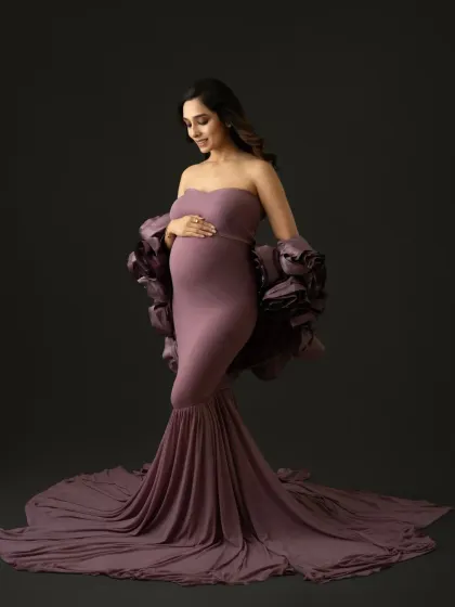 This mauve gown with dramatic floral sleeves is a true showstopper. A side profile is perfect for showcasing the baby bump in these fine art maternity portraits.