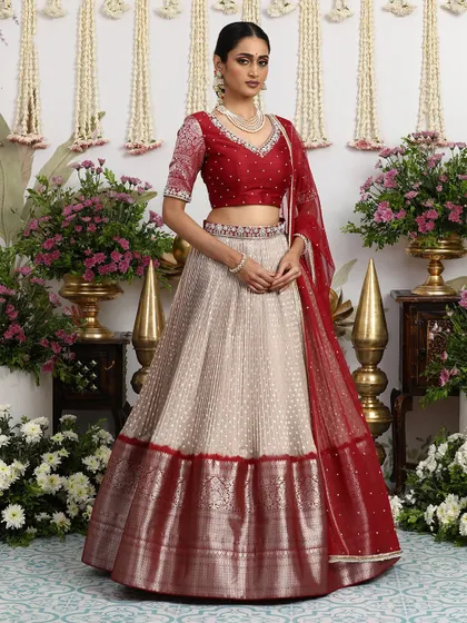 The complete look, with the dupatta elegantly draped, is a picture of grace and sophistication.