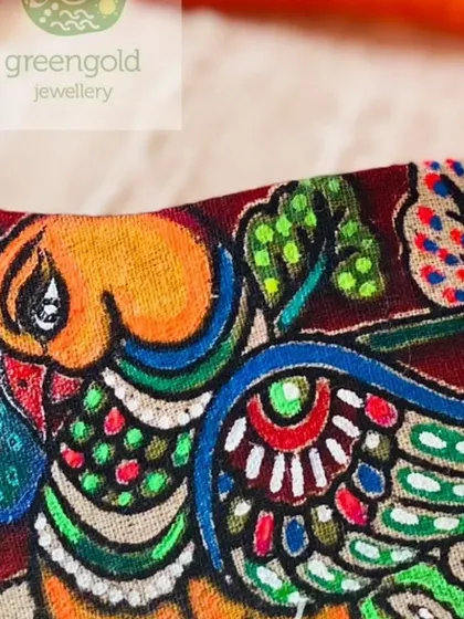 Another detailed shot of a fabric piece, this time with my logo. You can see the texture of the cloth and the vibrancy of the hand-painted colors.