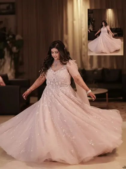 The bride twirls in her fairytale gown, a moment of pure joy and elegance captured during her engagement party.