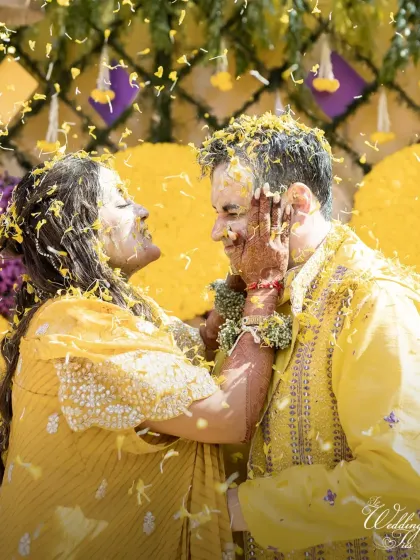 A close-up of the couple's happy faces during the phoolon ki haldi, a moment of pure, unadulterated joy.