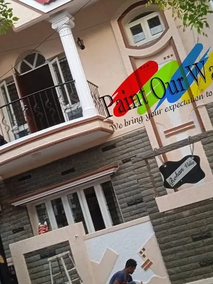 Our team is equipped to handle large, multi-story homes. This shot shows our painters at work, ensuring consistent color and quality across the entire exterior surface.