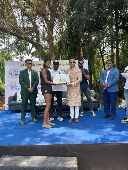 Aasara being awarded for her second-place finish in the 5K race.