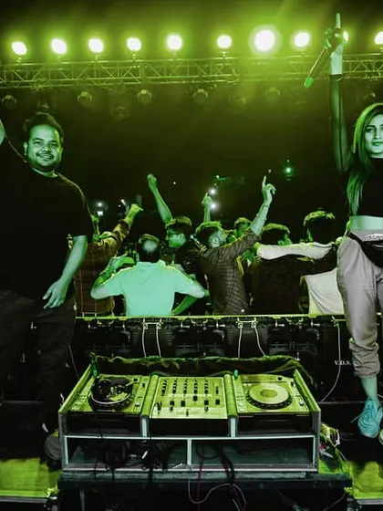 Posing with my talented friend DJ Perisha during a performance. I love collaborating with other artists in the industry to create unique and dynamic shows.