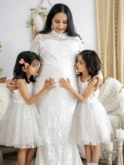 The excitement of expecting a new arrival, shared with the older siblings. Maternity sessions with the whole family are a wonderful way to document this special time.