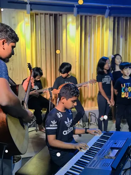 A full band of young campers rehearsing for their final performance. They learn to play together, listen to each other, and work as a team.