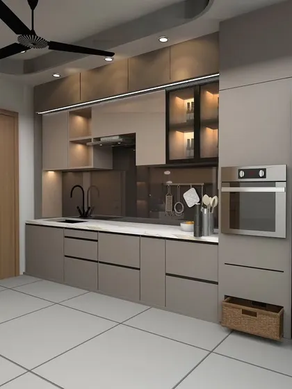 An open-concept kitchen design featuring sleek, handleless cabinets and a built-in oven. The glass-fronted upper cabinets with internal lighting are perfect for displaying crockery.