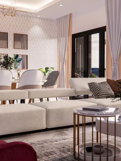 The living room of the 'Eleganza' project, showing a comfortable sectional sofa and a view towards the mirror-clad dining wall.