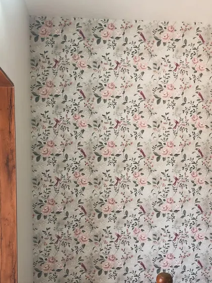 Another installation of the same peony wallpaper, showing its versatility in a different room setting.
