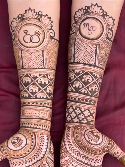 This design features the engagement date "5.5.2024" and the couple's initials, surrounded by elephant motifs and circular mandala patterns.