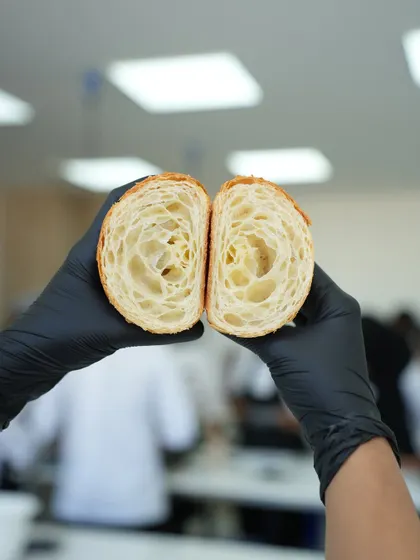 This perfect honeycomb structure is what every baker strives for in a croissant. It's a testament to mastering the lamination technique, which we teach in-depth to ensure you can create these buttery, airy pastries.