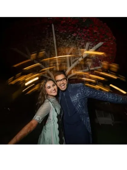 A collage of fun and energetic moments from a Sangeet night, from couple portraits to the groom's grand entrance.