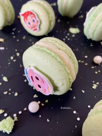 Custom macarons made for a Cocomelon themed birthday party. I can add edible images to macarons to fit any party theme, making them a unique addition to a dessert table.