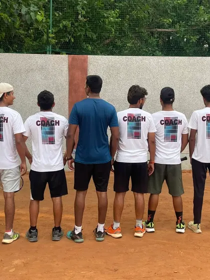 The back of our coaching jerseys. Our team stands united in our mission to guide our players to success.