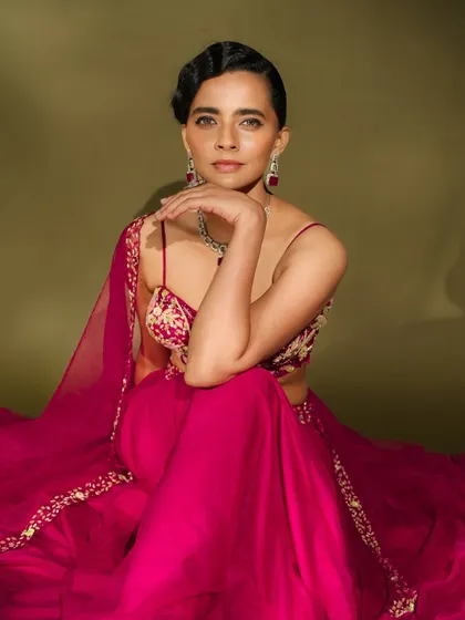 A close-up on the modern lehenga look. The makeup features a clean, defined eye, contoured cheeks, and a neutral lip, allowing the outfit and jewellery to shine.