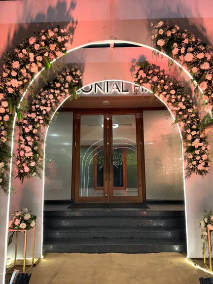A straight-on view of the floral arch entrance, creating a perfect frame for the doors beyond. This design is both inviting and incredibly photogenic, a favorite for many of my clients.