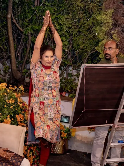 A guest shows off her yoga moves during a fun, interactive session at the Mehendi, highlighting the personalized and engaging activities I plan.