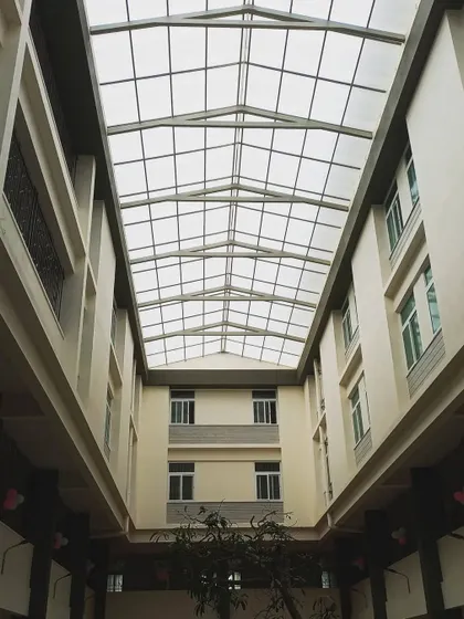 Natural light is a key material in my designs. This expansive skylight over the courtyard at the St. John's hostel block transforms the space, filtering light deep into the building and creating a bright, uplifting environment for residents.