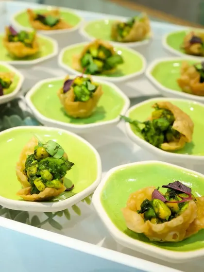 Crispy wonton cups filled with a fresh and flavourful mixture. The vibrant green plates make the presentation pop, adding a splash of colour to your event.