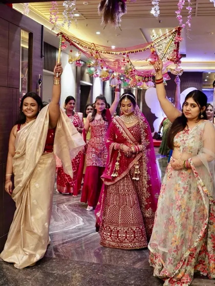 Another angle of the bride's beautiful entrance, surrounded by her loved ones.