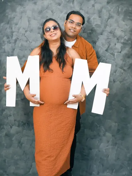 A fun studio shot using large letters as props. This is a great way to hint at the baby's initials or name in a creative way.