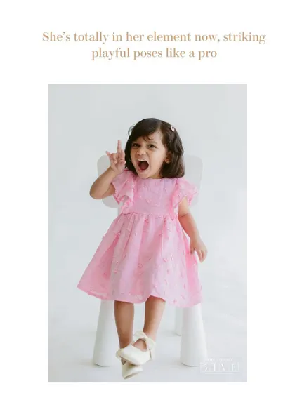 Now she's totally in her element. Once kids feel comfortable in the studio, they love to show off their fun side, striking playful poses like a little rockstar.