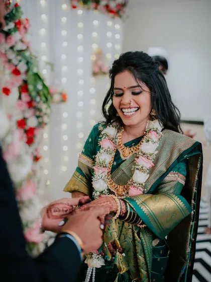A moment of pure joy as the bride-to-be laughs during her engagement ceremony.