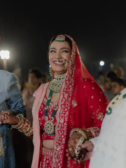 The pure joy on Bhavika's face. Her radiant smile is the best accessory, and her makeup is designed to look flawless even in candid, emotional moments.