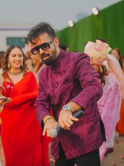 Dancing with the guests during the baraat. I don't just stay on the stage; I get into the crowd and dance with everyone.
