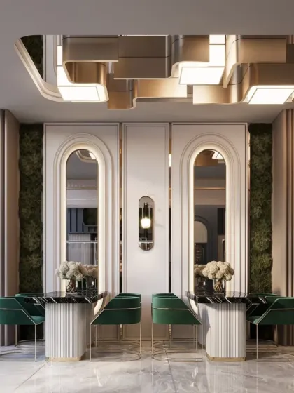 A look at the elegant symmetry in this restaurant design, featuring arched mirrors and preserved moss walls. The ribbed dining tables and velvet chairs add texture and a touch of art deco glamour.