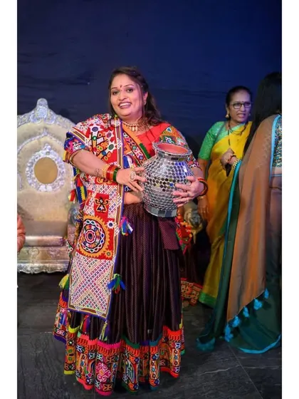 A guest enjoying the festivities. Her makeup is glowing and her traditional outfit is absolutely stunning.