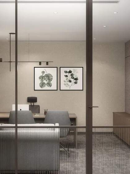 A glimpse into a private cabin at the Hamdard HQ, where biophilic artwork and warm, textured materials create a calm and focused environment. The design balances transparency with privacy through the use of fluted glass.