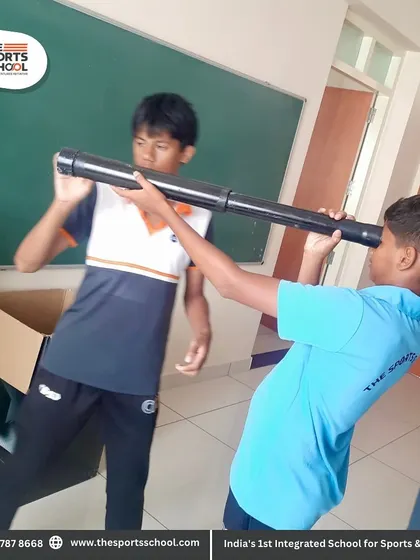 Two students collaborate on a project with a large telescope, fostering teamwork and curiosity in the science lab.
