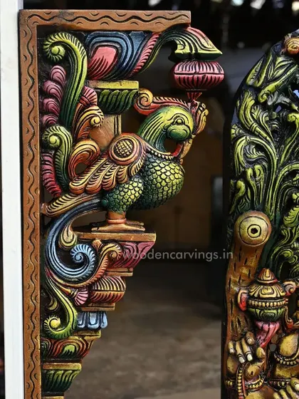 Another detail of the Annapakshi bracket, highlighting the intricate patterns on its feathers and the blend of colors.
