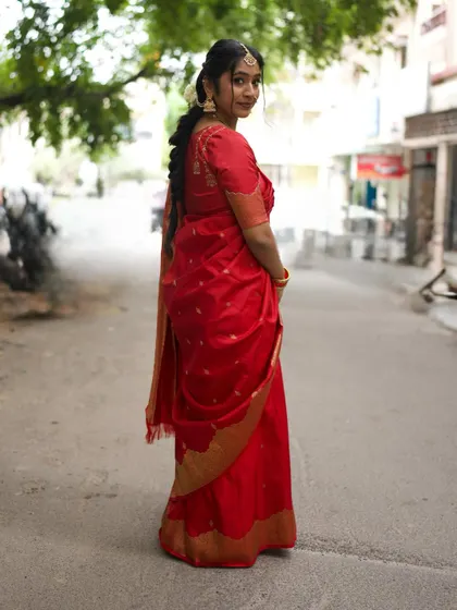 A full view of my Ganesh Chaturthi look, featuring a traditional braided hairstyle with a maang tikka and flowers.