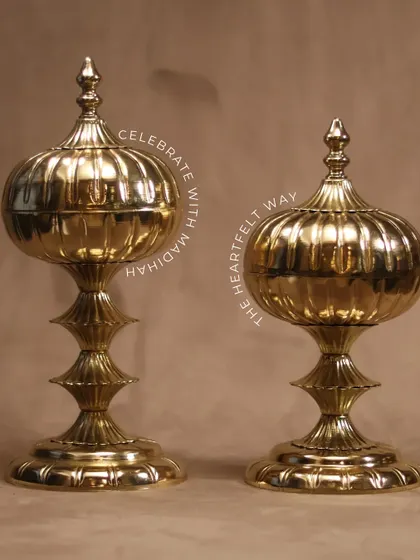 Celebrate with the heartfelt way. My Mughal Gold Jars, with their classic silhouette and polished gold finish, are a timeless piece of decor, perfect for holding sweets or treasures.