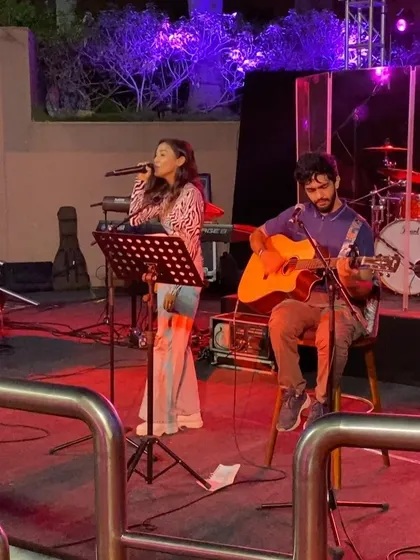 Another memory from my first Bangalore performance. The red stage lights and the focus in this moment bring back all the feelings of excitement and gratitude.