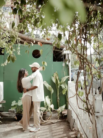 A beautifully framed shot using natural elements to create a sense of intimacy and privacy for the couple during their pre-wedding shoot.
