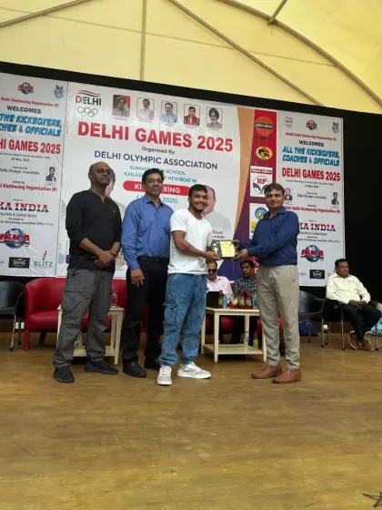 Our head coach receiving an award for his contribution to kickboxing at the Delhi Games 2025.