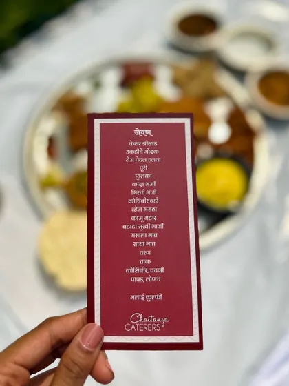 A menu card written in Marathi for a traditional Maharashtrian Pangat, showing my commitment to authentic and personalized experiences.