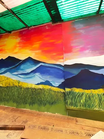 This angle shows how the sunset mural wraps around the space. The continuous landscape makes the room feel larger and more open.