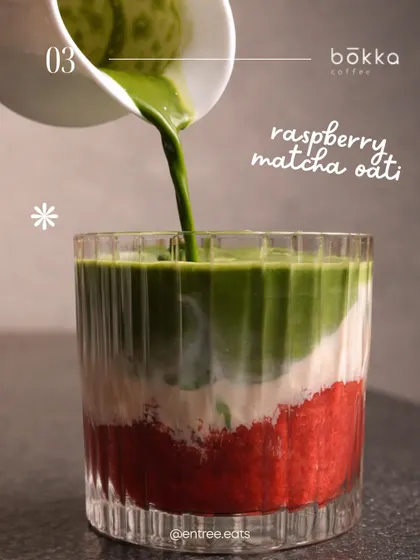 A layered Raspberry Matcha Oati from Bokka Coffee. The distinct layers of red, white, and green create a beautiful visual that is perfect for social media.